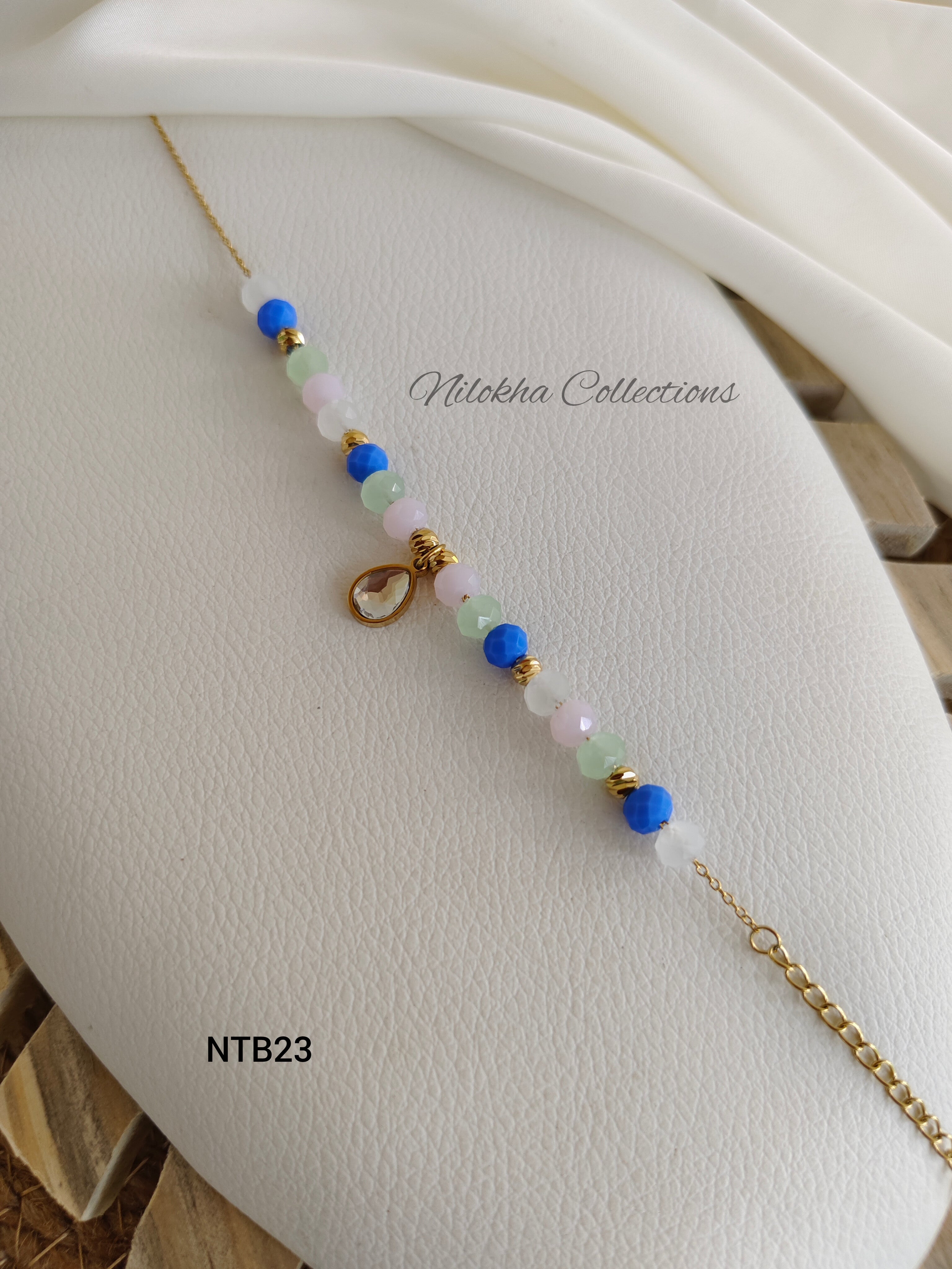 Crystal bracelet with teardrop stone charms | NTB23